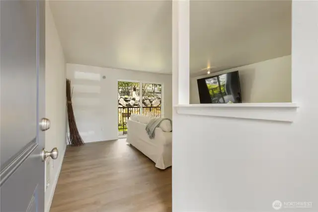 Gleaming new luxury vinyl plank floors and light throughout with slider to your own deck