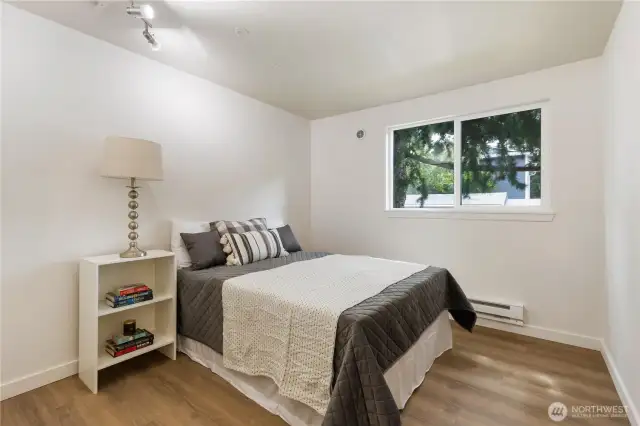 Bedroom with new luxury vinyl floors and fresh paint