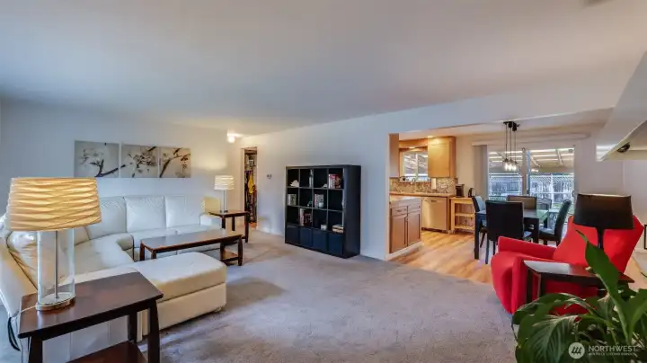 Relax and entertain with ease in this open living area that flows beautifully into the dining room and kitchen.
