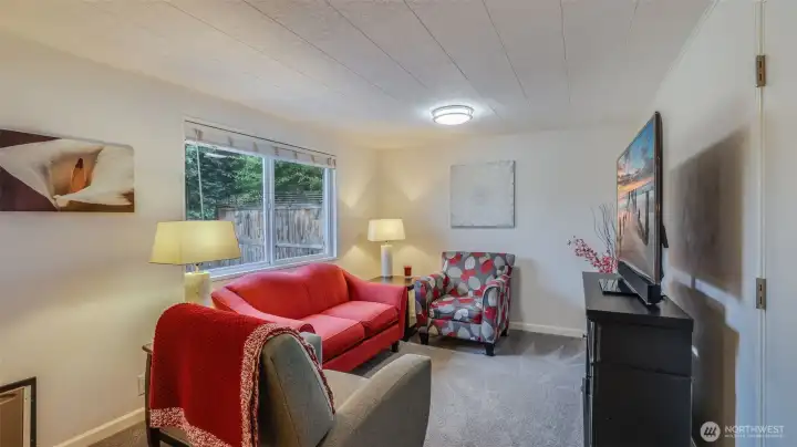 Versatile second living space/flex room, perfect for a cozy lounge, home office, or play area.