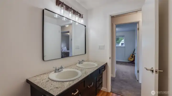 This 3/4 bathroom is complete with an updated double vanity offering ample storage.