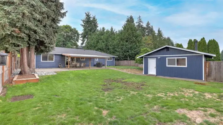 Framed by mature trees and fully fenced for added privacy and peace of mind.