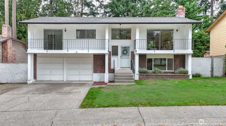 Welcome to Candlewood — a beautifully maintained home tucked into a quiet, tree-lined neighborhood. Step inside to find light-filled living spaces, walls of windows & a cozy wood fireplace. The open-concept layout connects the kitchen, dining, & living areas seamlessly — perfect for entertaining. A spacious primary offers a private retreat, while additional bedrooms provide flexibility for guests, work, or play. Enjoy outdoor living on the deck overlooking a lush & spacious yard backing to green space for added privacy. Located just minutes from shops, dining, parks, & schools, this home combines suburban serenity with easy access downtown Renton and major freeways for easy commuting. This home is ready for you to make it your own!