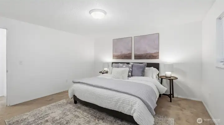 Spacious and tranquil primary retreat designed for relaxation and rejuvenation.