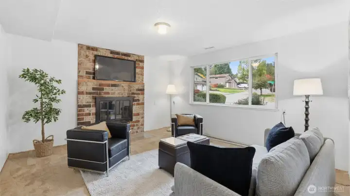 Cozy lower-level living space perfect for movie nights or casual gatherings by the fire.