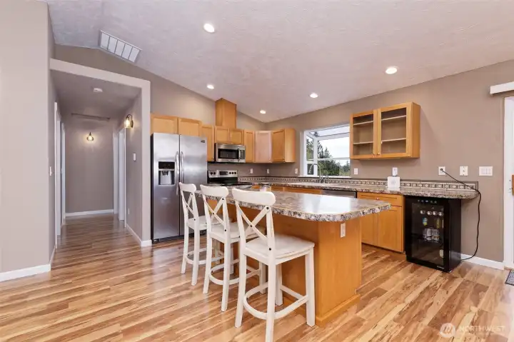 Great-room concept living room and kitchen with a handy breakfast bar.
