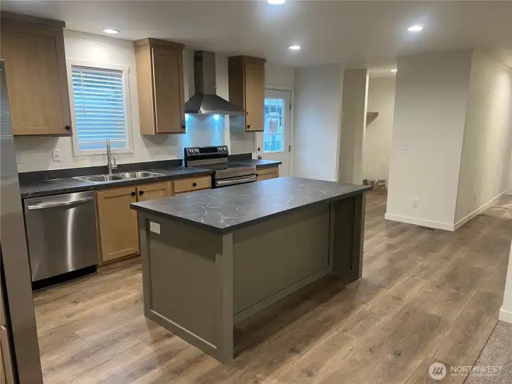 Kitchen looking at hall to bedrooms and utility room.