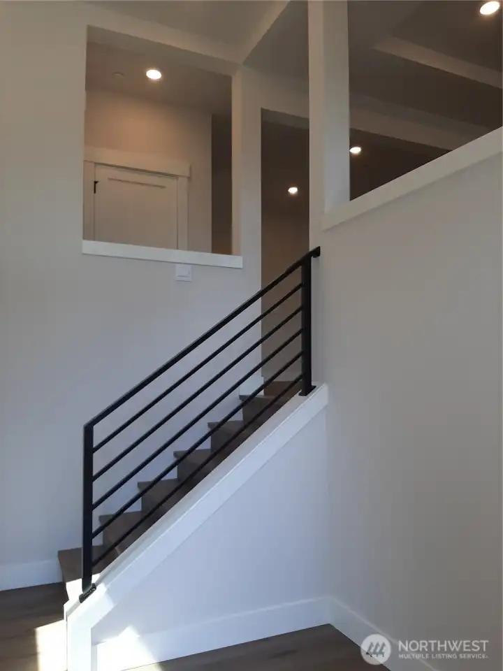 Entry looking towards main level great room.  Photos are of a similar home-features can vary-ask site agent for details