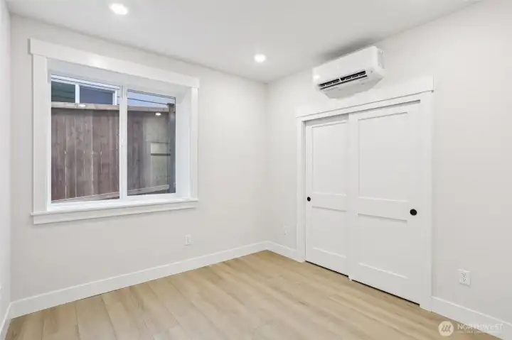 Lower level 5th bedroom with efficient mini-split for heating and cooling.  Photo is of similar home-details & finishes will vary-ask site agent for details