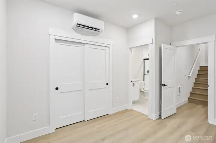 Lower level 5th bedroom makes an ideal guest suite with attached bath.  Photo is of similar home-details & finishes will vary-ask site agent for details