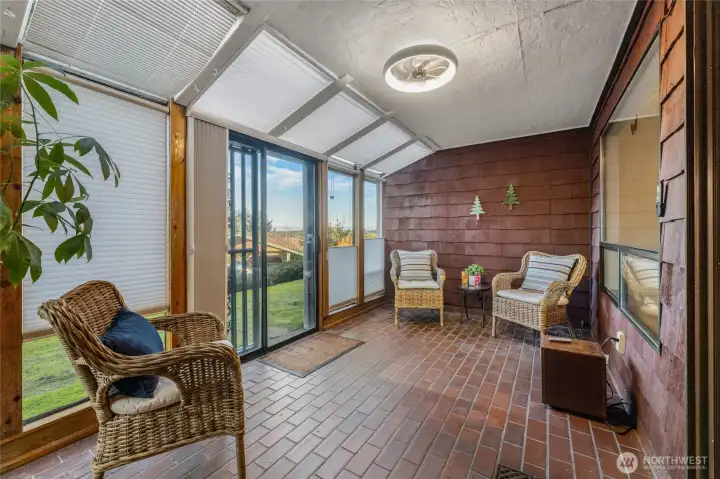 Fully enclosed 4-season porch with electricity, perfect for office, guest space and enjoyment year-round