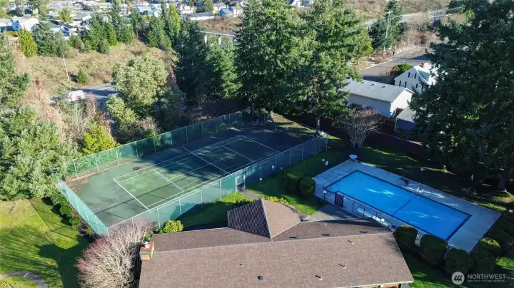This condo community has a tennis court, pool and clubhouse with sauna