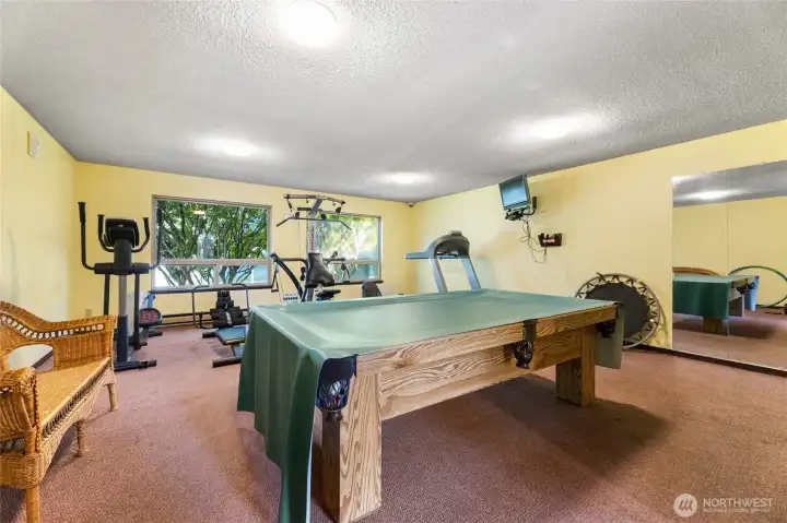 Community clubhouse has pool table and workout room
