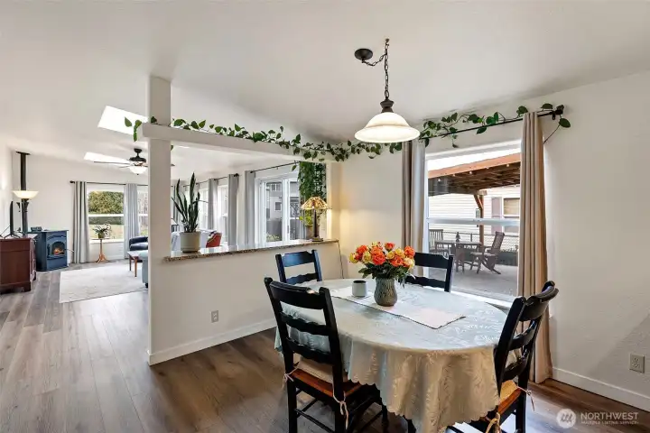The dining area is designed as an open and inviting space that seamlessly connects to the second living room, creating a comfortable and versatile area for both dining and relaxing.