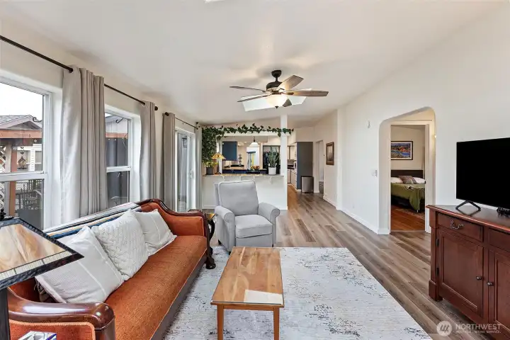 Another look back through this spacious home.  Two bedrooms and a bath to the right.  The primary suite is separate and just off the other living space.  Amazing flow!