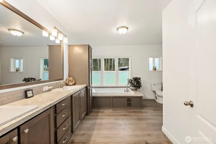 Beautiful 5 piece primary bathroom offers spa-like relaxation