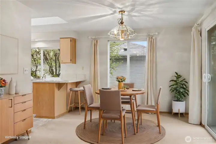 Dining room view from your family room, huge windows again, and patio doors leading to your peaceful backyard. ***Virtually Staged***