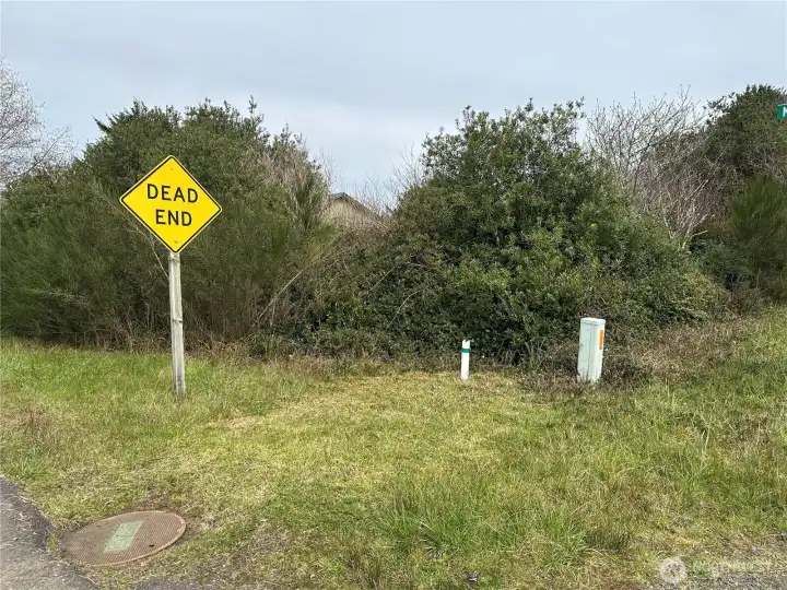 Sewer and electric on the corner lot at street entrance
