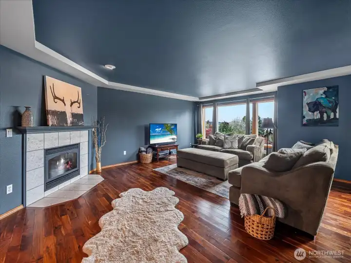 Living room for large gatherings and windows with views of the Orting Valley.