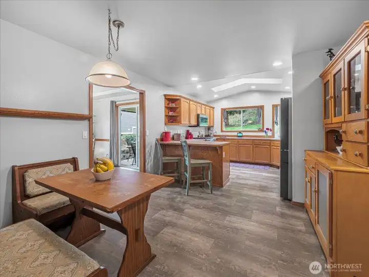 Kitchen has space for a dinette table and coffee station.