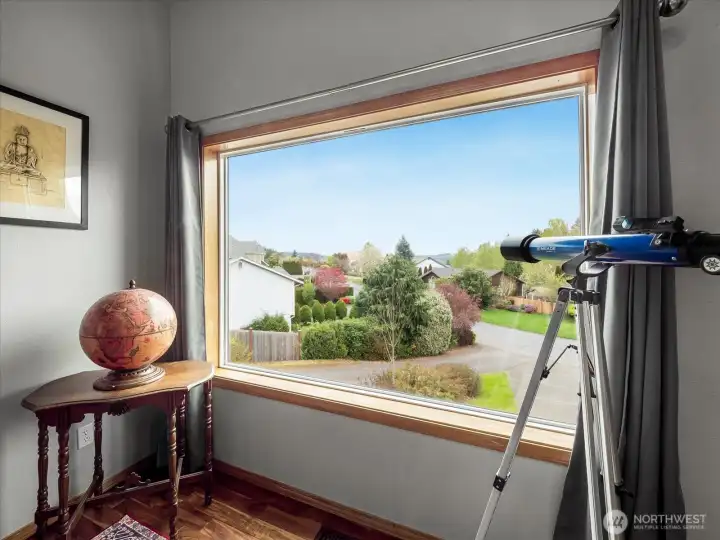 Two large windows in the library or home office.