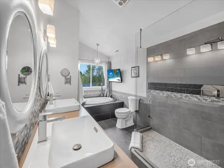 Primary bath with double sinks, jetted tub, and double shower.