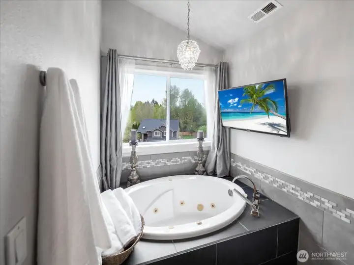 Watch your favorite shows from the jetted tub.