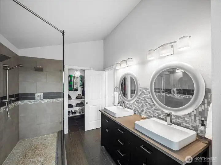 Walk-in closet with space for two sets of clothing is off the primary bathroom.