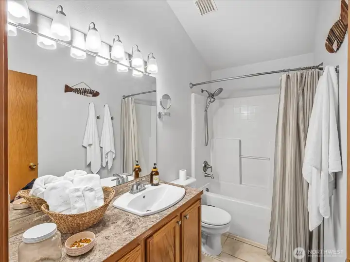 Secondary bathroom with extra counter space.