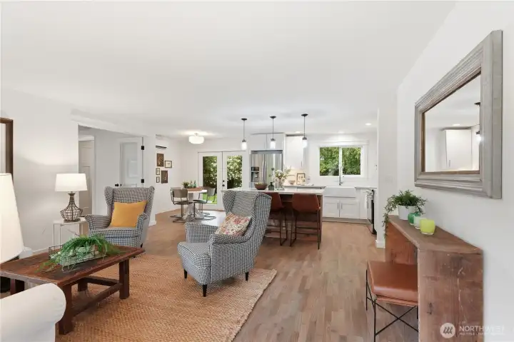 Bright and inviting open concept rambler featuring freshly buffed hardwood floors and beautiful natural light throughout.