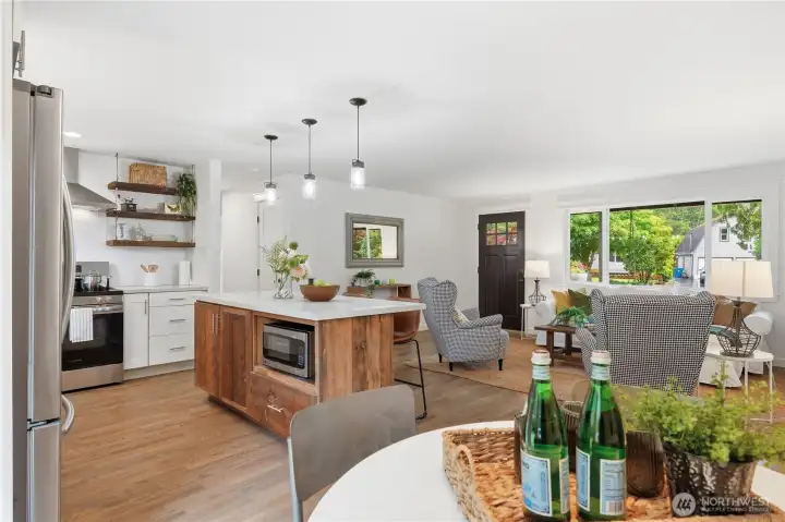 Spacious open-concept living, dining, and kitchen areas create the perfect gathering space.