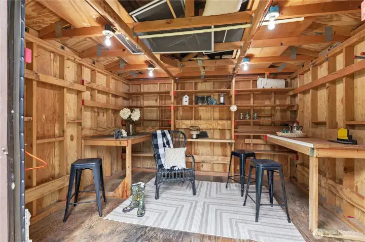 Multi-use outbuilding ideal for extra storage, creative studio space, recreation, tools, or a charming playhouse.