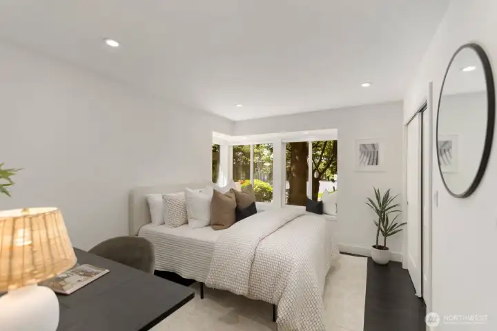 Secondary bedroom shines with en suite bath, large windows and a cozy window seat overlooking the beautiful trees and flowers in the front yard! Large enough for guests plus an office space!