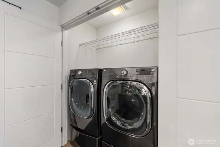 Featuring LG Black Stainless Steel Front Loading Washer and Dryer + Twin Sidekick Pedestal Washer for added convenience.