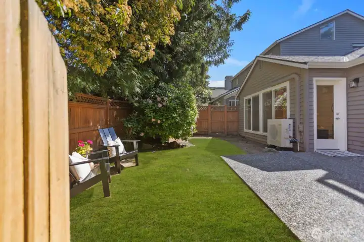 The private backyard is one of the standout features of this condo, offering a true sense of home with space for barbecues, entertaining, or unwinding with a glass of wine after a walk along the waterfront.