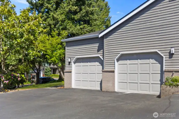 Large attached 2-car garage with built-in storage racks, providing ample space for beach gear and more.