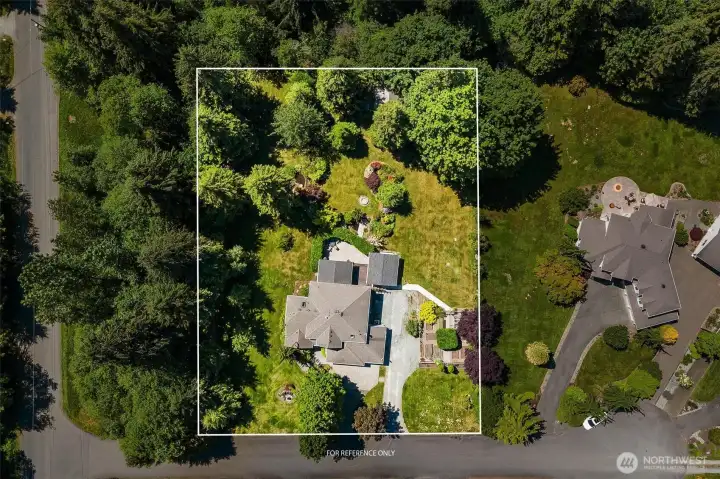 Enjoy the privacy of a full acre surrounded by mature landscaping, open space, and a setting that's becoming harder to find.