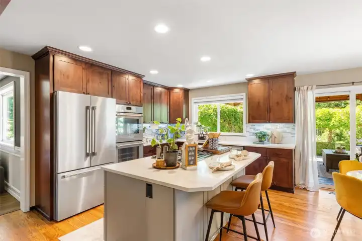 The Heart of the Home    Featuring quartz countertops, Thermador stainless steel appliances, and generous prep space, this kitchen is ready for everything from busy mornings to holiday gatherings.