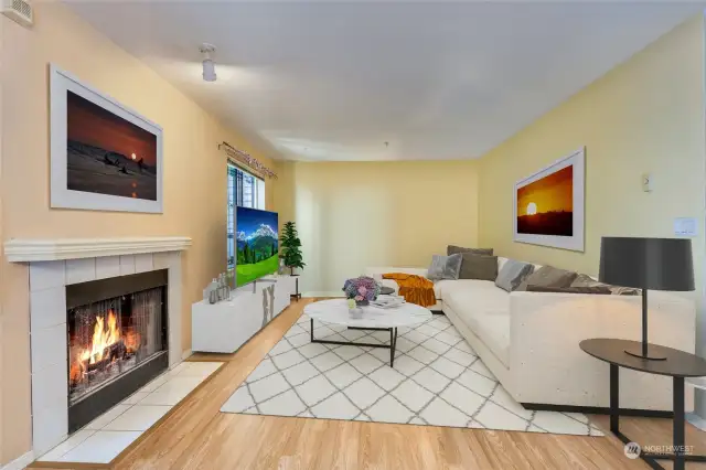 Spacious living room with wood burning fireplace. Home is virtually staged