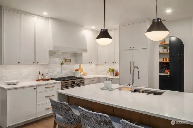 Kitchen with archway to rare, butler's pantry