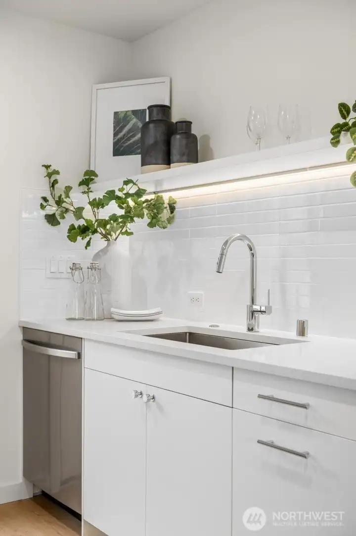 Photos of model home with similar finishes & floor plan. A close-up of that designer touch. From the matte hardware to the curated décor.