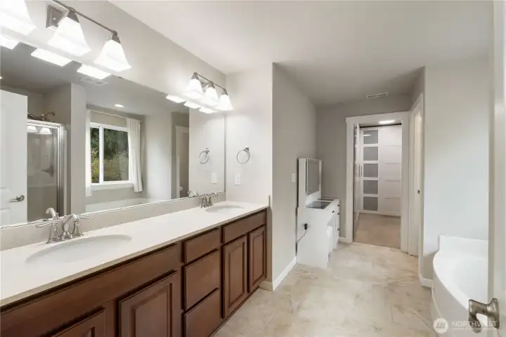 Primary bathroom has lots of cabinet space