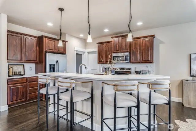 Whether it’s morning coffee chats or late-night laughs, this oversized island is the heart of the home. Pull up a seat—there’s always room for one more.