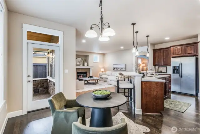 Bright, open, and effortlessly elegant: coffee in the breakfast nook, cozy nights by the fire, and easy access to the covered patio—perfect for weekend BBQs.