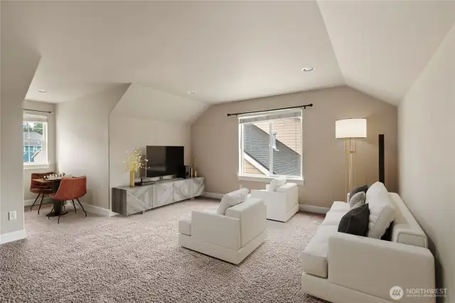Expansive bonus room ideal for movie nights, a gym, gaming or playroom.   Photo virtually staged.