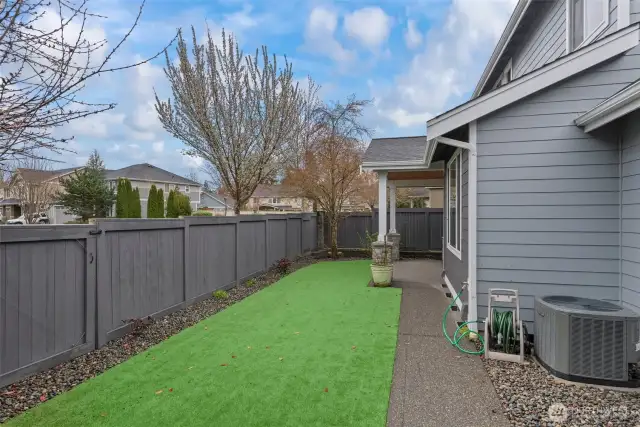 Low-maintenance backyard with brand new artificial turf, freshly stained fence, private gate access to the sidewalk, and convenient access to the garage. A high-efficiency heat pump keeps the home cool in summer and warm in winter. Sprinkler system in front & back.