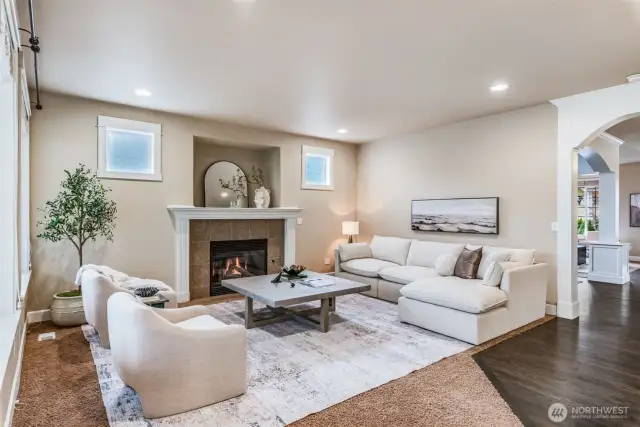 Open layout connects the den to the kitchen and dining spaces for effortless flow, perfect for entertaining.