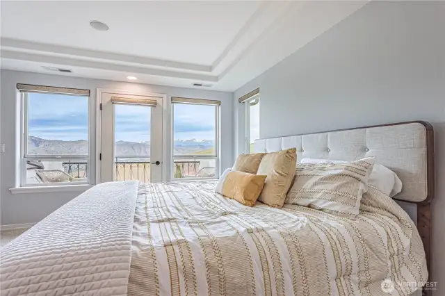 Primary Bedroom with view and balcony
