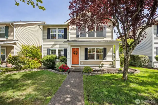The orange door offers a hint at the personality this home has to offer.  Come explore in person this meticulously updated home.