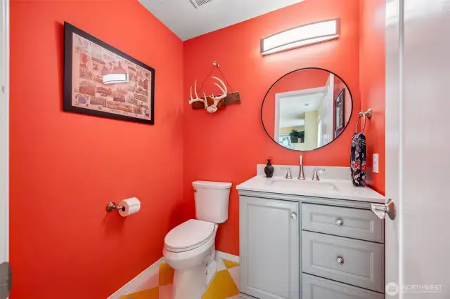 Downstairs powder bath with updated vanity.